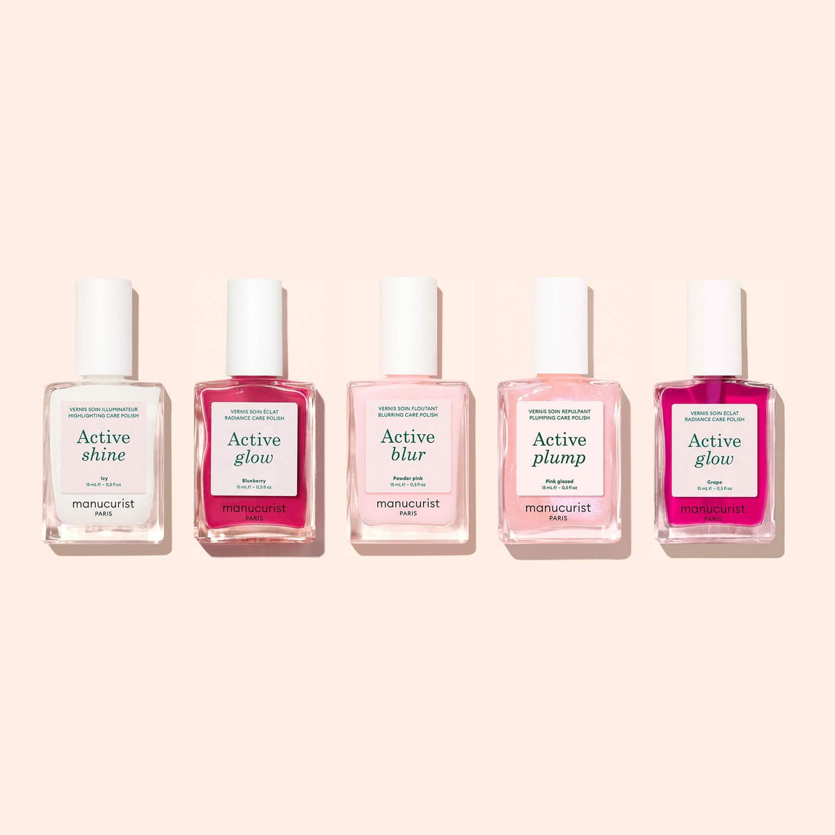 Five bottles of Manucurist nail polish in a row—Active™ Shine Icy, Active Glow, Active Blur, Active Plump, and Active Glow—are displayed on a pale pink background, offering brighter-looking nails and enhanced nail care.