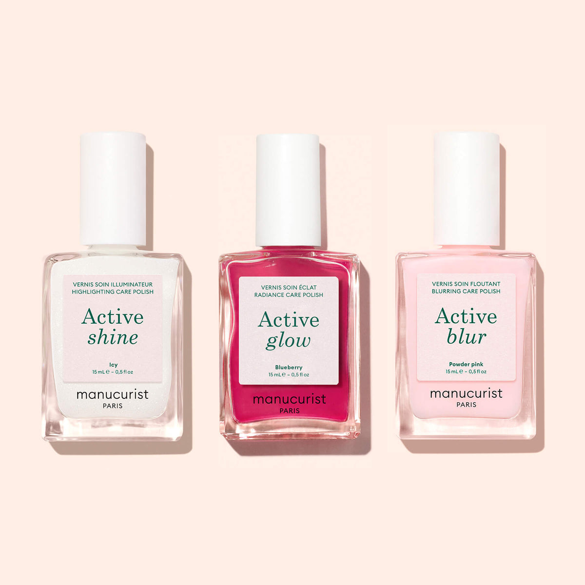 Three bottles of Manucurist Active™ Shine Icy nail polish, displayed side by side against a light pink background—perfect for anyone looking to brighten their nails with an illuminating polish as part of their nail care routine.