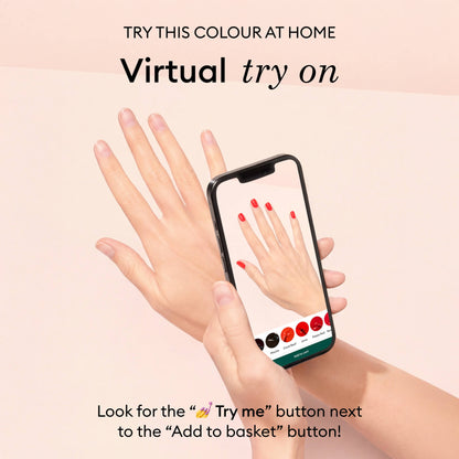 A hand holds a smartphone showing Manucurist’s Violeta gel polish virtual try-on, perfectly matching the real nails. The light pink background promotes Manucurist’s virtual nail polish try-on feature.