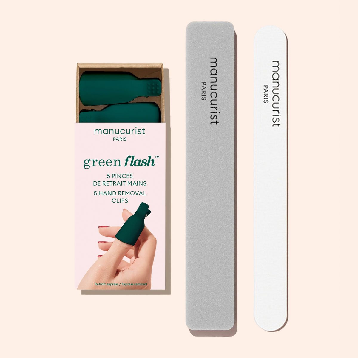 Box of Manucurist Nail Clips with a gray nail file and a white nail buffer displayed on a pale pink background. A hand demonstrates the quick gel polish removal process by using one of the Manucurist Nail Clips from the box.