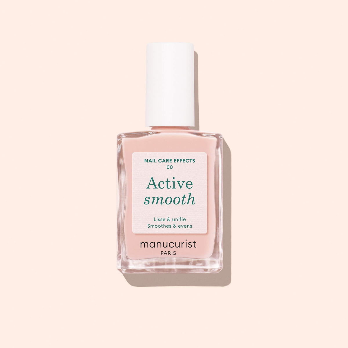 A bottle of Manucurist Active™ Smooth 00 nail care polish with a white cap is displayed against a light pink background—this CC Polish Treatment is the ultimate perfector for beautifully smooth, healthy-looking nails.