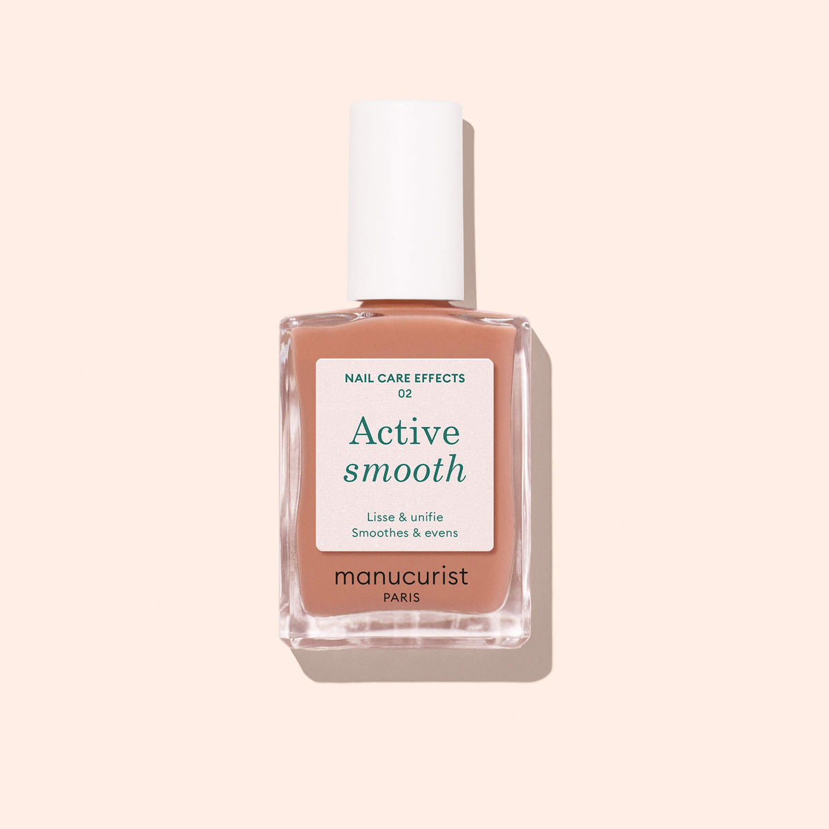 A bottle of Manucurist Active™ Smooth 02 nail care polish, featuring a white cap and set against a light beige background—an ideal perfecting treatment for flawless nails.