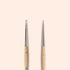 Two Manucurist Dotting Tools with metal tips and wooden handles stand upright side by side on a beige background—ideal for precise nail art designs in your tool collection.
