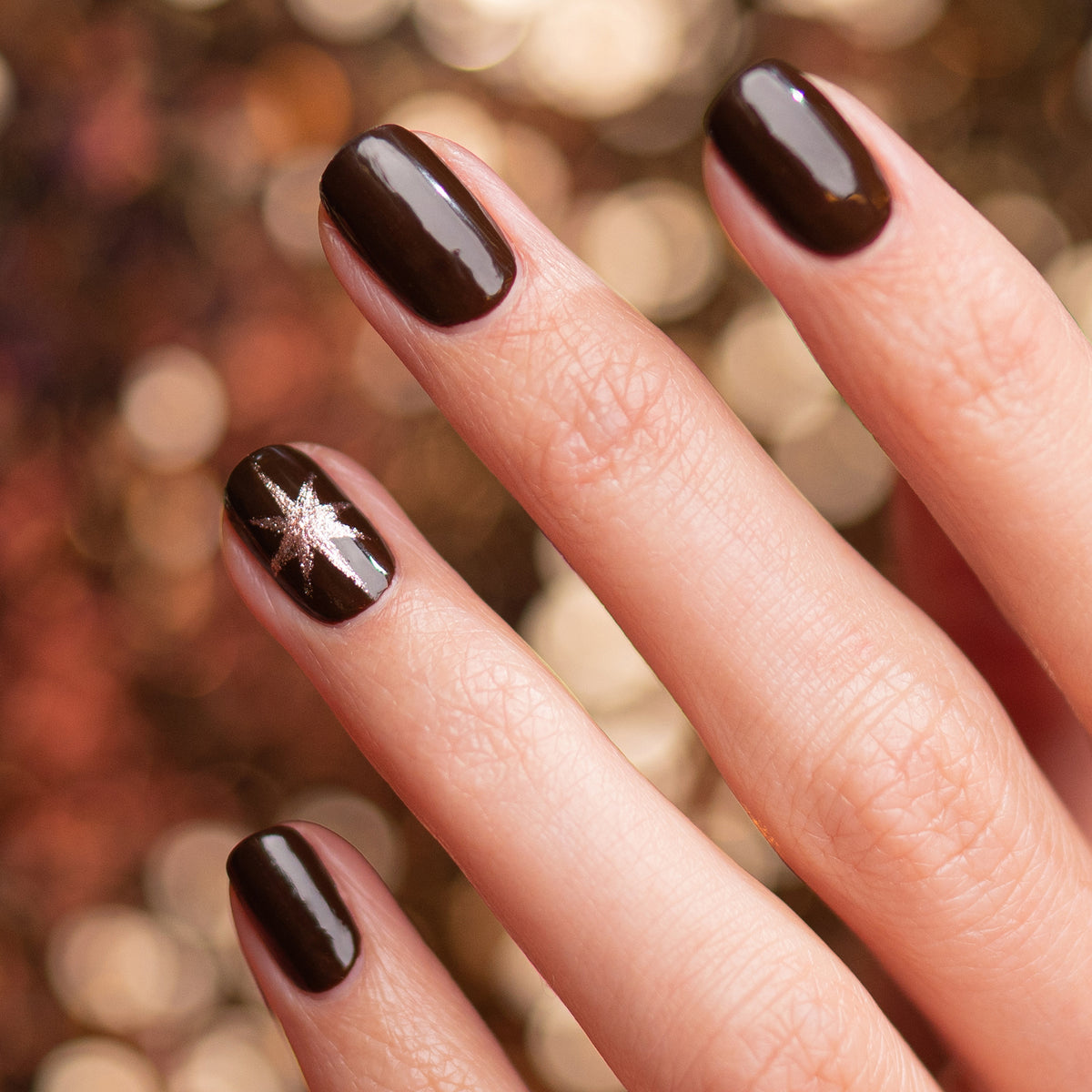 A hand showcases Manucurist&