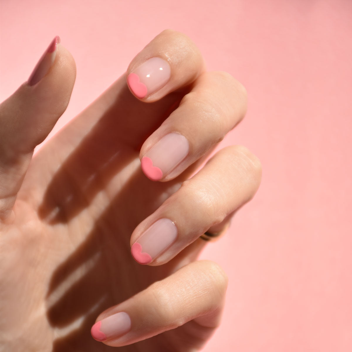 A hand with neatly manicured nails features Manucurist&