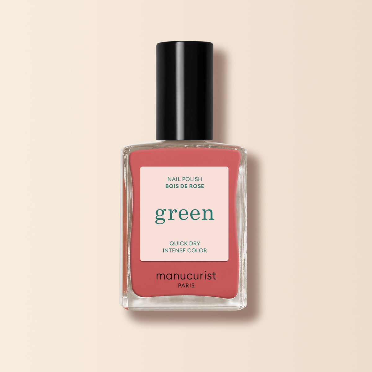 Manucurist’s Bois de Rose nail polish, a rosewood pink shade from the Green™ range, comes with a black cap and a label stating "green" and "quick dry intense color".