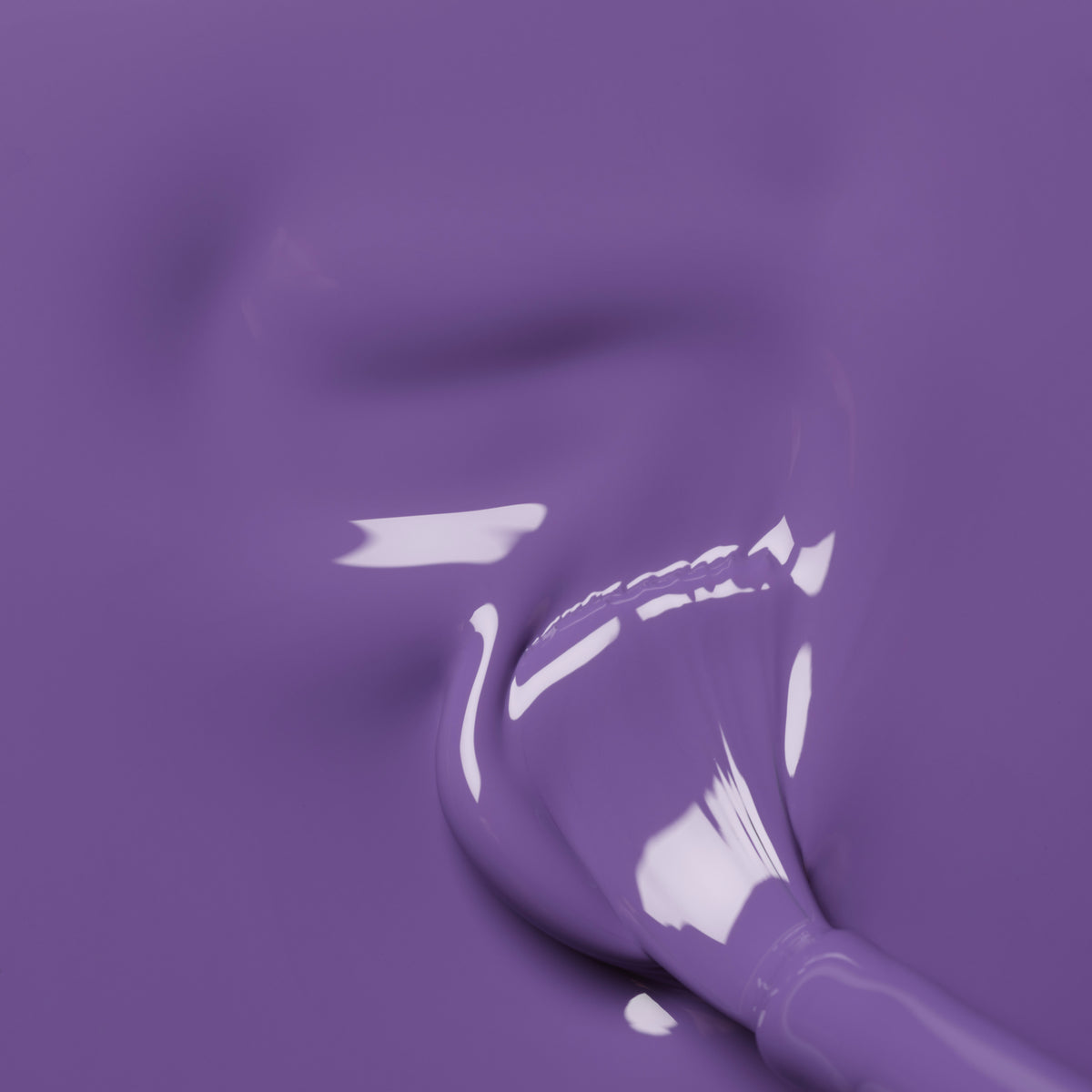 A close-up of a brush gliding through Manucurist&