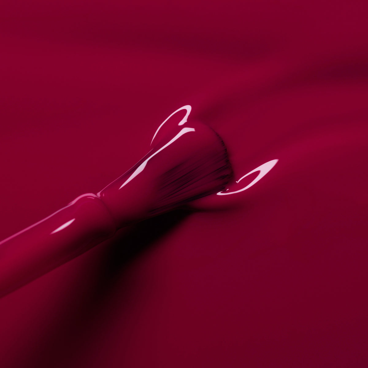 A close-up of a makeup brush coated in Manucurist&