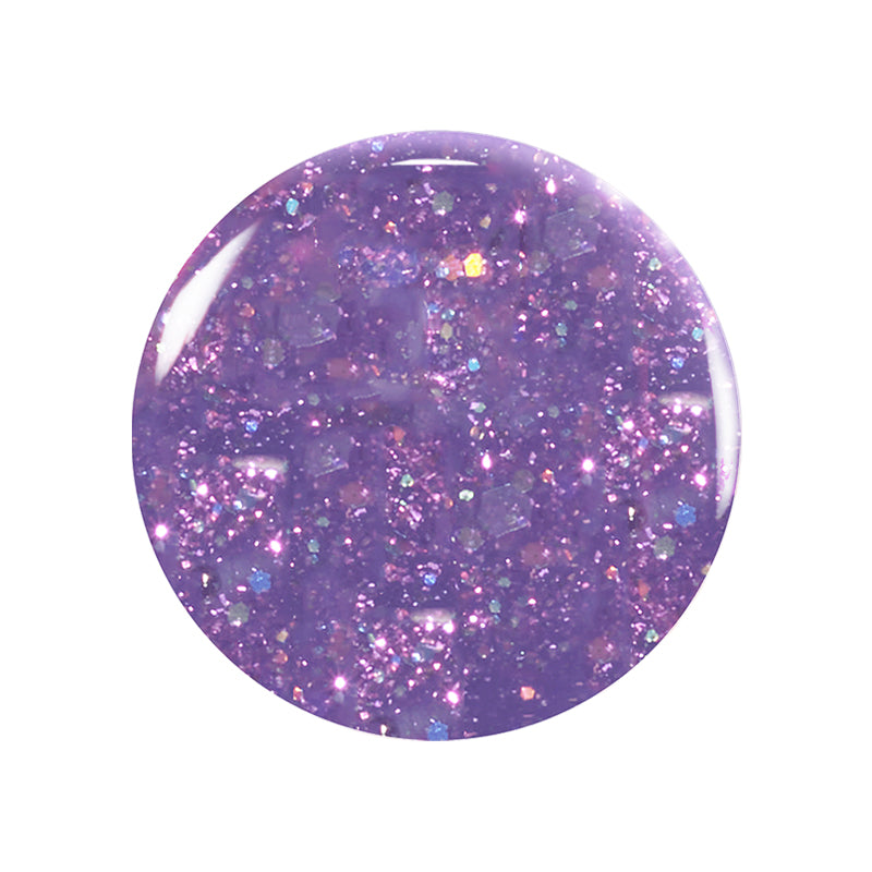 A round swatch of Manucurist Betty Scarlett Stella set non-toxic purple glitter nail polish with iridescent chunky sparkles, shown on a white background.